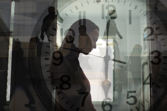 Time pressure and mental burnout concept with clock overlay and busy people walking while exhausted person overwhelmed by modern life
