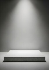 Obraz premium Empty Concrete Podium in Dark Studio with Dramatic Overhead Spotlight
