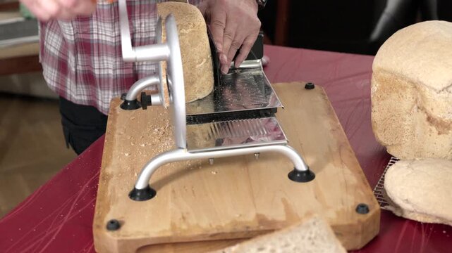 Slicing fresh bread at home