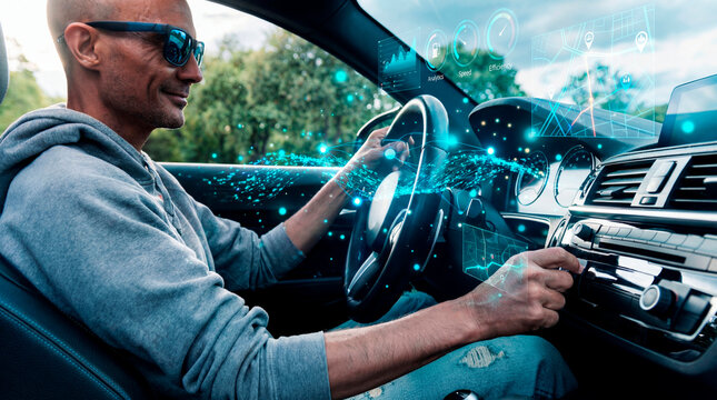 Confident man driving connected car with digital analytics display