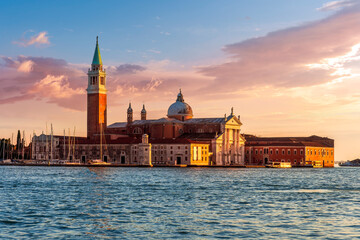 beautiful view at Abbey of San Giorgio Maggiore from San Marco square in Venice, Italy. Venetian sunset landscape of antique architecture. © Yaroslav