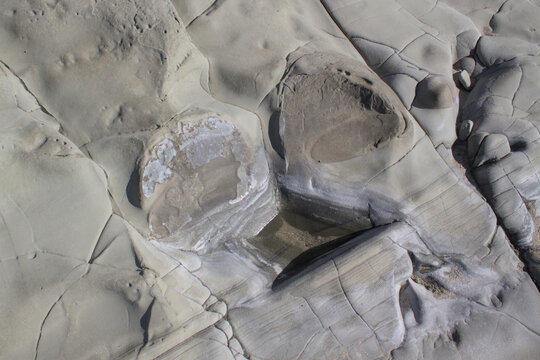 Close-up of eroded rock formations with natural textures and patterns in Ngapali, Rakhine State, Myanmar. Geological coastal detail shaped by erosion in tropical Southeast Asia.