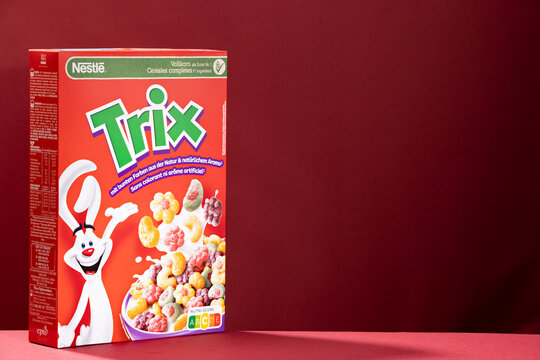 Nestle Trix breakfast cereal box displayed on red gradient background with copy space. Popular colorful cereal product sold in Germany. Illustrative editorial.
