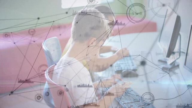 Girl typing and boy using mouse in classroom, keyboard input activating overlay for education