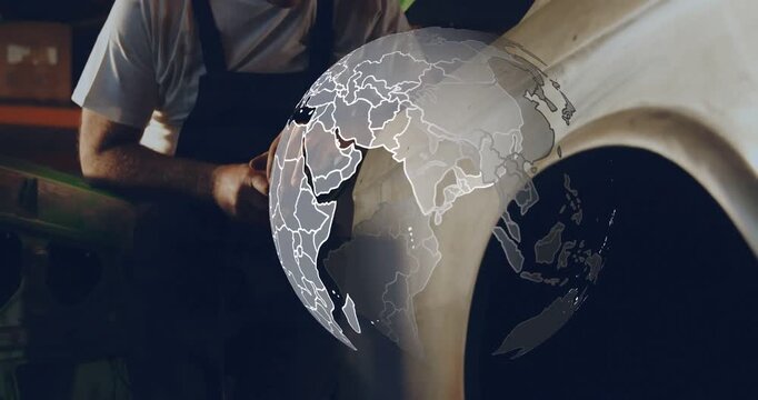 Vertical video: Auto tech starting grinder, grinding fender for repair, sparks under rotating globe
