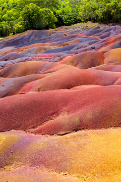 Chamarel Seven Colored Earth Geopark in Mauritius Island. Colorful panoramic landscape about this volcanic geological formation Chamarel Seven Colored Earth Geopark in Riviere noire district.