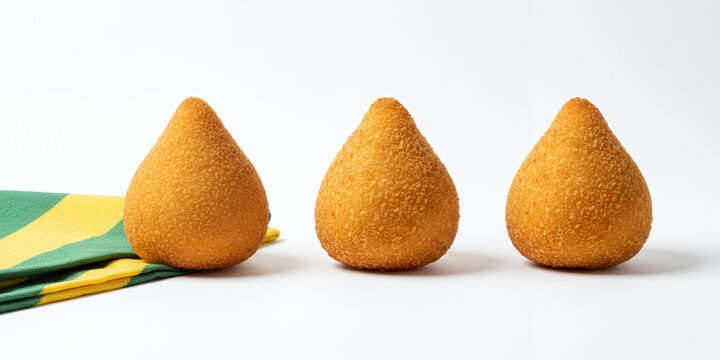 Three Brazilian Coxinhas with Green and Yellow Theme Isolated on White