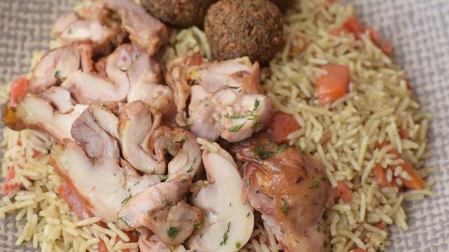 Kabsa or mandi, an Arabic dish with rice and chicken, salt, and spices. Kabsa or mandi as a food background for your design