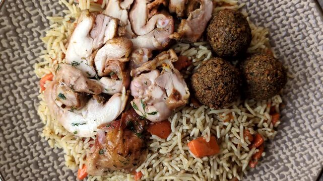 Kabsa or mandi, an Arabic dish with rice and chicken, salt, and spices. Kabsa or mandi as a food background for your design