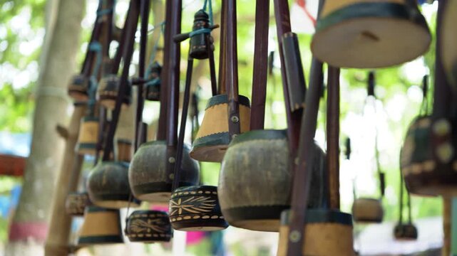 Traditional Bengali Ektara displayed for sale in a street shop, reflecting rich heritage, folk music culture, and local craftsmanship, perfect for themes of tradition and identity. Musical Instrument