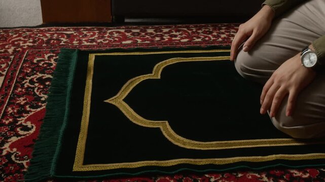 Cinematic close up shot of modern Muslim man performing Sujud while following religious tradition and performing daily prayer ritual, copy space