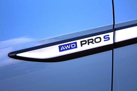 Vinnytsia, Ukraine; March 28, 2026. Close-up of light blue Volkswagen ID.4 AWD PRO S door badge. Volkswagen ID.4 AWD PRO S emblem. Glossy AWD PRO S emblem with blue "AWD" and black "PRO S" lettering o
