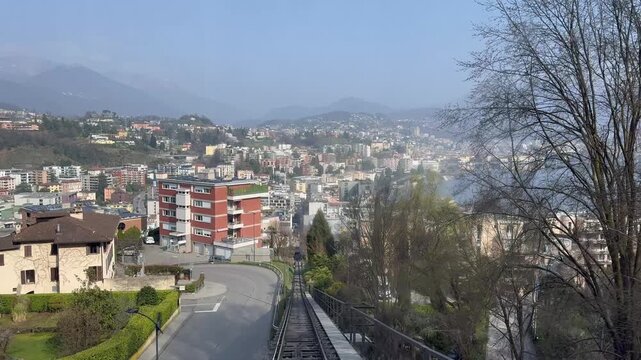 Panoramic view of Lugano city and Lake Lugano from Monte San Salvatore funicular railway, Switzerland, urban and mountain landscape