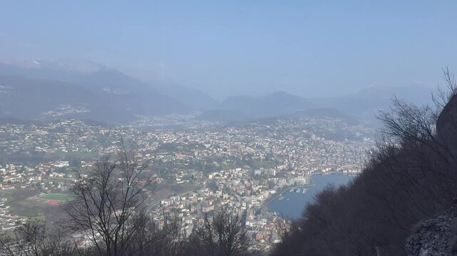 Panoramic view of Lugano city and Lake Lugano from Monte San Salvatore funicular railway, Switzerland, urban and mountain landscape