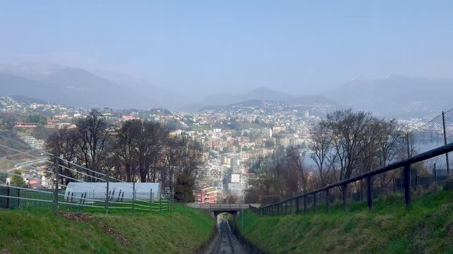 Panoramic view of Lugano city and Lake Lugano from Monte San Salvatore funicular railway, Switzerland, urban and mountain landscape