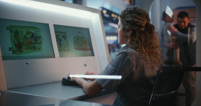 Concentrated Female Officer in Uniform Manages Scanning System at Security Checkpoint While Travelers Pass in Background. Reliable National Security, Professional Duty, Efficient Customs Clearance.