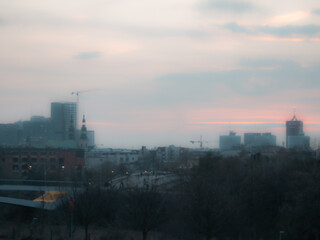 Hazy city skyline at dusk © Łukasz Bielaszewski