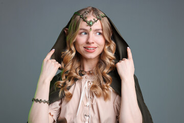 Obraz premium Portrait of beautiful elf girl on grey background