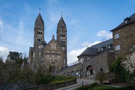 Twin towers of Clervaux Parish Church from the road, Luxembourg