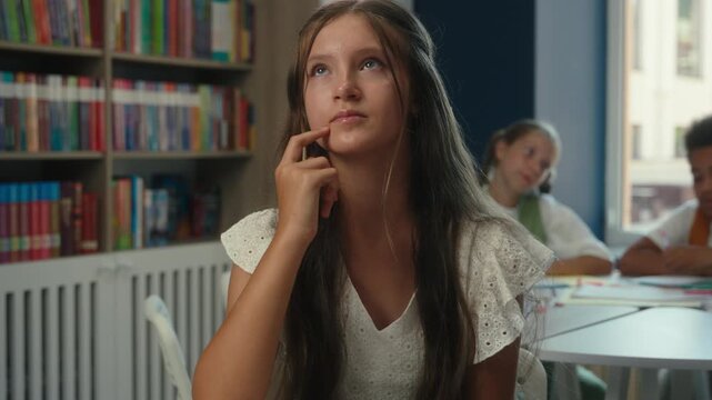 Puzzled teenager girl student thinking idea Caucasian teen female think solution education studying problem learning hesitate kid child teenage schoolgirl daughter learn study in class school library
