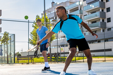 Pickleball players enjoying a sunny day of training and competition