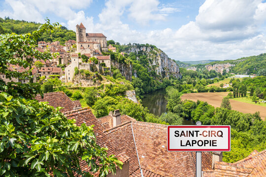 Medieval village of Saint-Cirq-Lapopie with added village sign illustration - France