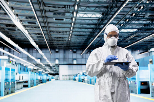 Designing silicon wafers, microchip factory and PCB systems architect walking. Inspecting semiconductor substrates infrastructure, protective gear and employee doing quality control with device