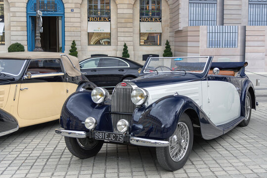 Paris, France - September 5th 2019 : View on a white and blue Bugatti Type 57 C cabriolet Gangloff from 1938 parked on a street.