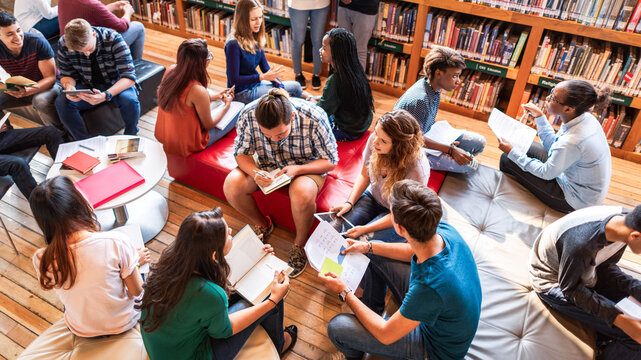 Students collaborating in library setting