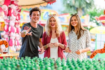 Friends enjoying carnival game fun