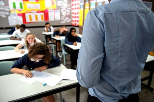 Classroom exam with focused students.