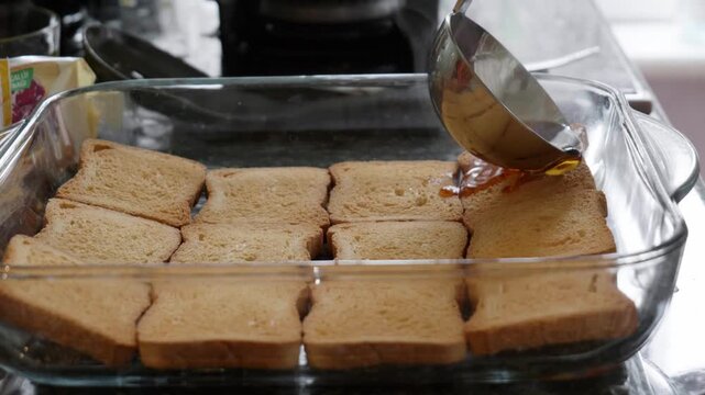 Pouring Hot Syrup Over Fried Bread Slices Slow Motion