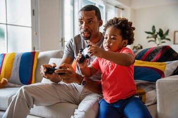 Father and child gaming together. © Rawpixel.com