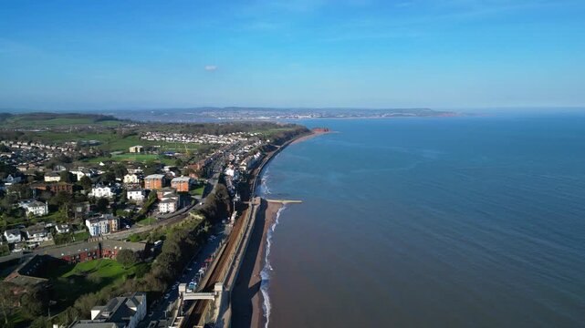 Dawlish, Devon, England: DRONE VIEWS: The drone flies over Dawlish railway station and the mainline track. Dawlish is a popular UK tourist destination on the mainline railway to London Paddington.