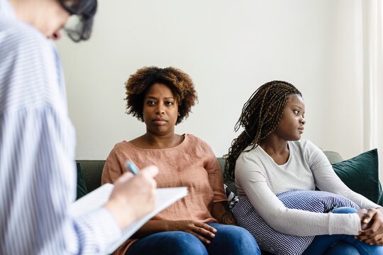 Therapy session with diverse individuals.