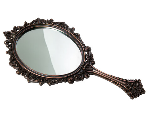 Isolated ornate vintage handheld vanity mirror with decorative bronze frame and intricate details