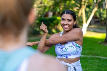 Obraz premium Woman stretching outdoors smiling
