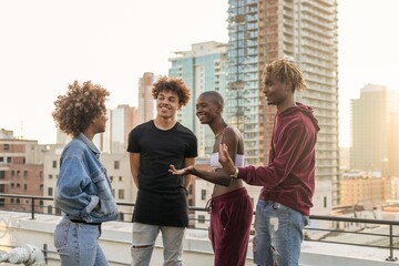Fototapeta premium Friends enjoying rooftop conversation photo