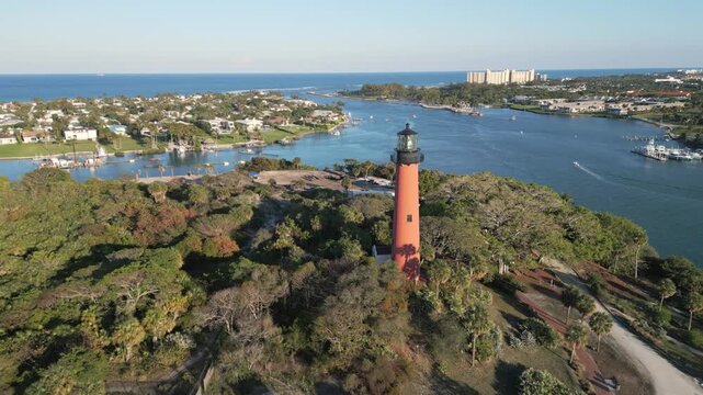 Aerial footage of lighthouse at Jupiter, Florida. Luxury Summer family vacation destination.