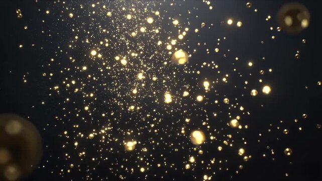 Glittering cloud of golden beads and glitter drifting forward in studio, triggered by top light