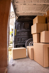 Cardboard boxes inside delivery van.