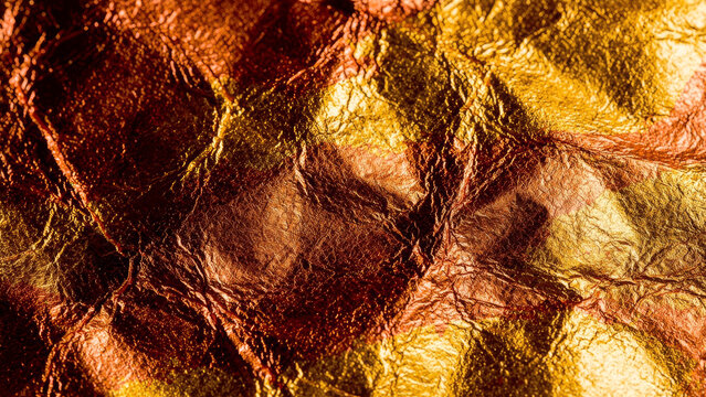 Crumpled gold and copper metallic foil texture