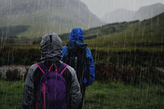 Hikers exploring nature under rain