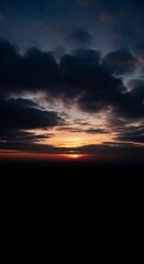 Fototapeta premium A somber sky fills with dark clouds during a fading sunset, evoking deep feelings of sorrow, loneliness, and a heavy, moody atmosphere, dark, clouds, longing