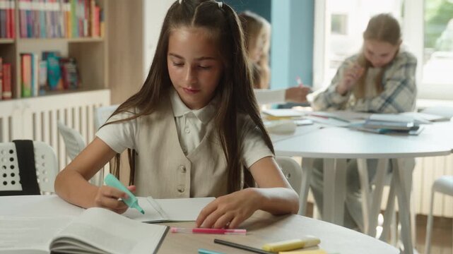 Dissatisfied Caucasian little girl child showing thumb down writing exam inside school classroom frustrated kid schoolgirl looking camera pupil dislike result displeased teen student education problem