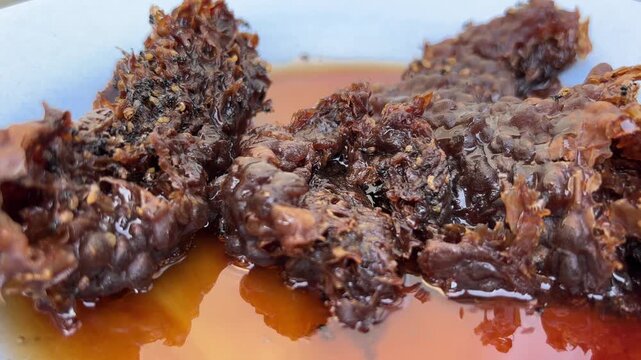 Klenceng bee nest (Apis florea) with the condition of the nest producing honey and eggs that have hatched. Klanceng bee larvae/pupae that have come out of the nest.