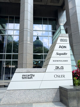 Corporate directory sign with BDO, AON, and Saputo logos - Montreal, Canada - July 2, 2025