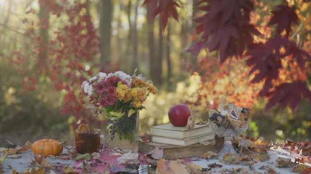 Golden leaves in a autumn forest. Autumnal mood. Autumn beauty. Maple leaves in sunlight. Autumn fall movement. Autumn foliage. Beautiful fall leaves. Red maple branches against blurred movement.