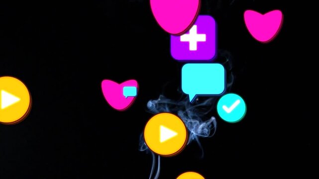 Rising gray smoke column weaving among drifting hearts, chats, ticks, pluses, play buttons on black