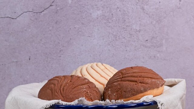 The iconic Mexican concha, freshly baked, rotating on a turntable
